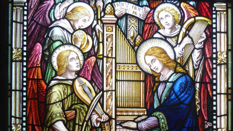 St. Cecilia at the organ and some angels playing instruments