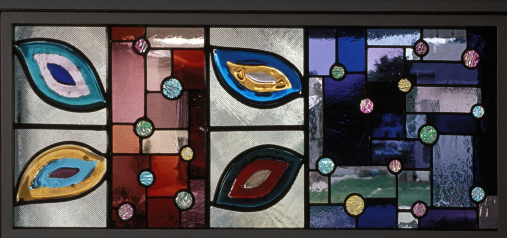 Detail featuring the colored fields with spons and a fused glass tree motif